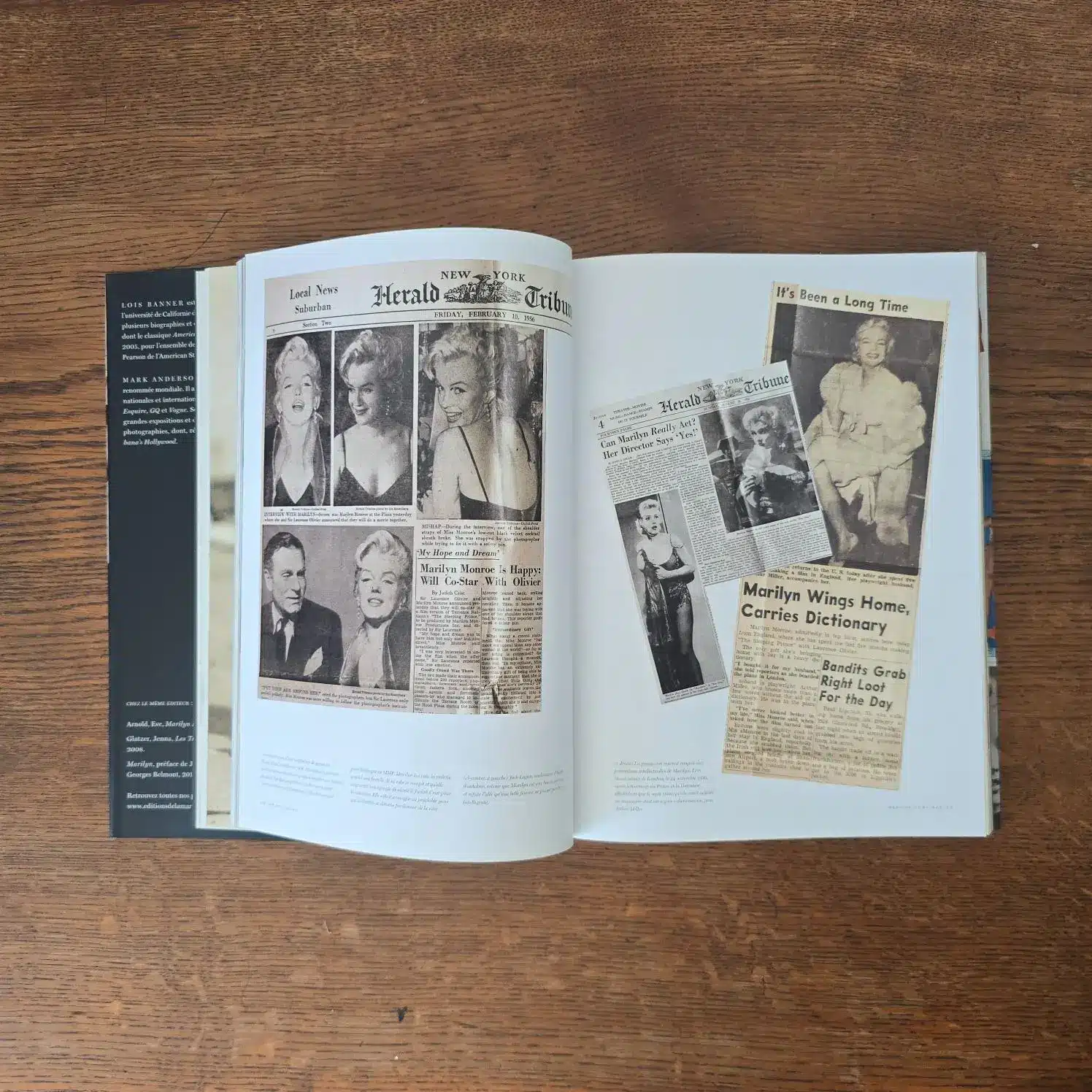 Double page du livre MM Personal avec reproduction d’articles de presse et photos.