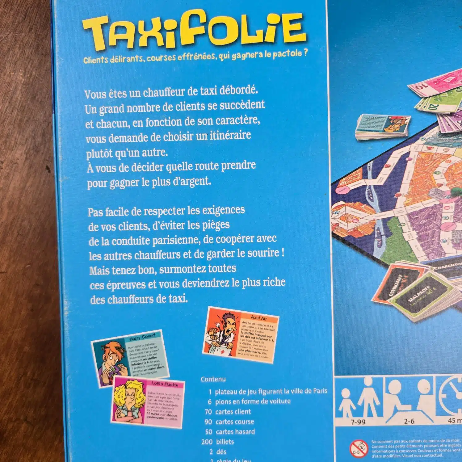 Jeu de société TaxiFolie Ravensburger 2006, vue rapprochée de la notice au dos de la boîte