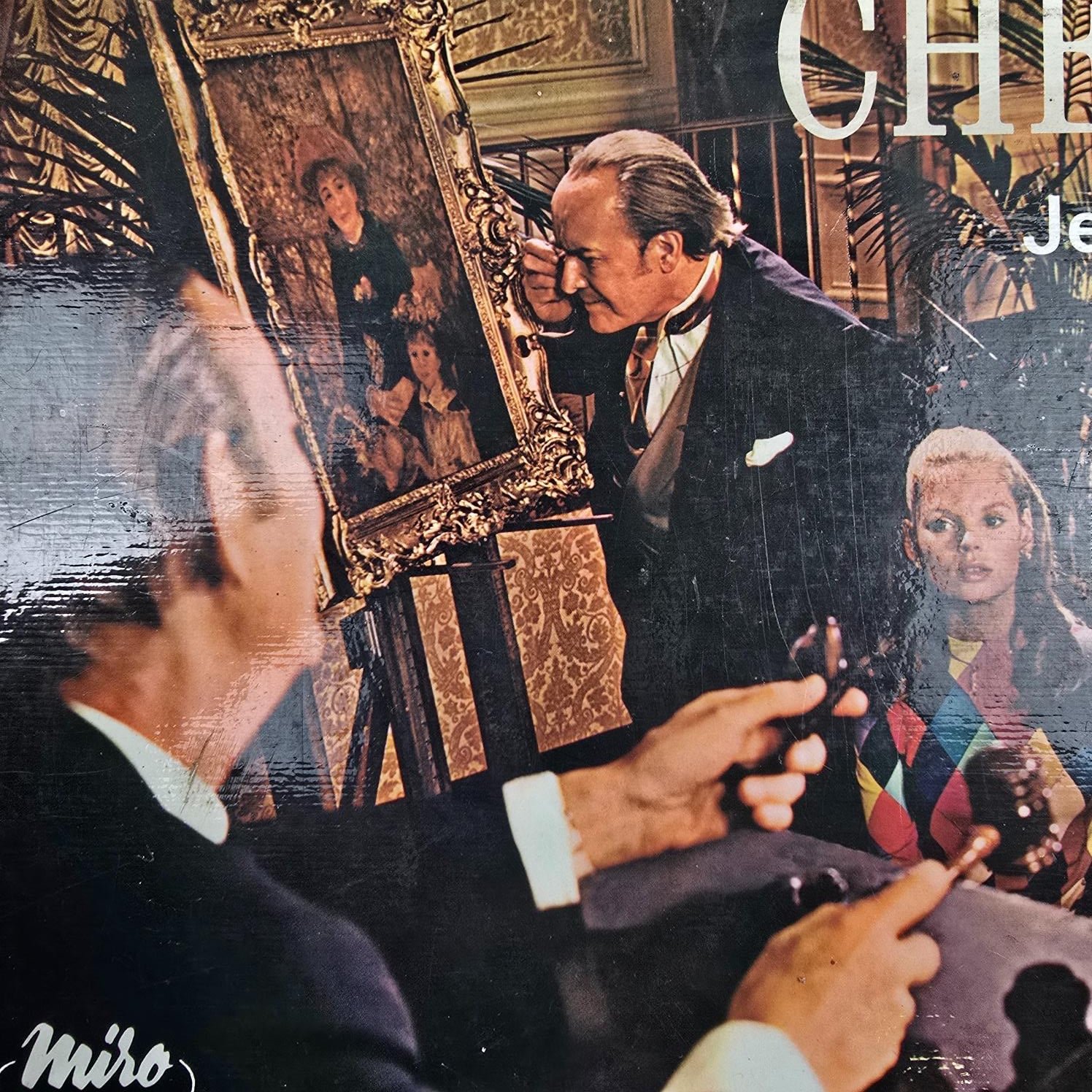 Scène de vente aux enchères illustrée sur la boîte du jeu Chefs-d’œuvre