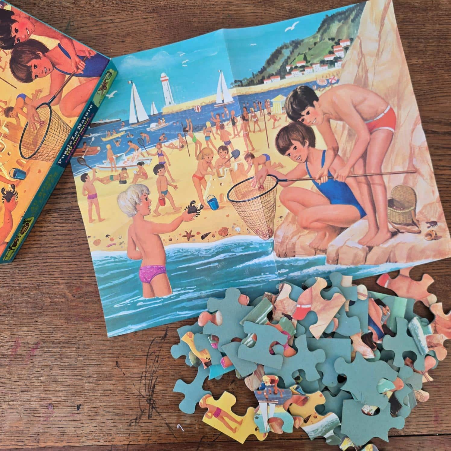 Puzzle Au bord de la mer Fernand Nathan assemblé, scène de plage illustrée