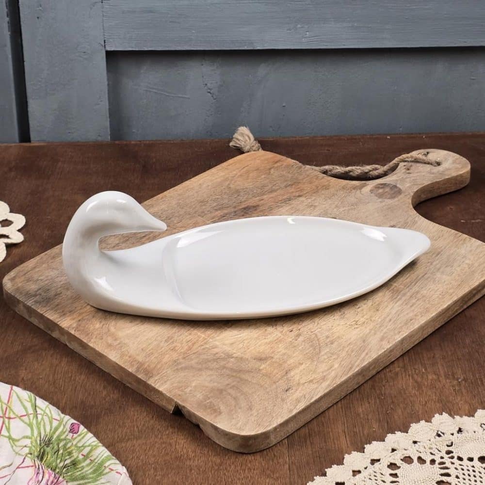 Petit plat à foie gras blanc en céramique, forme canard.